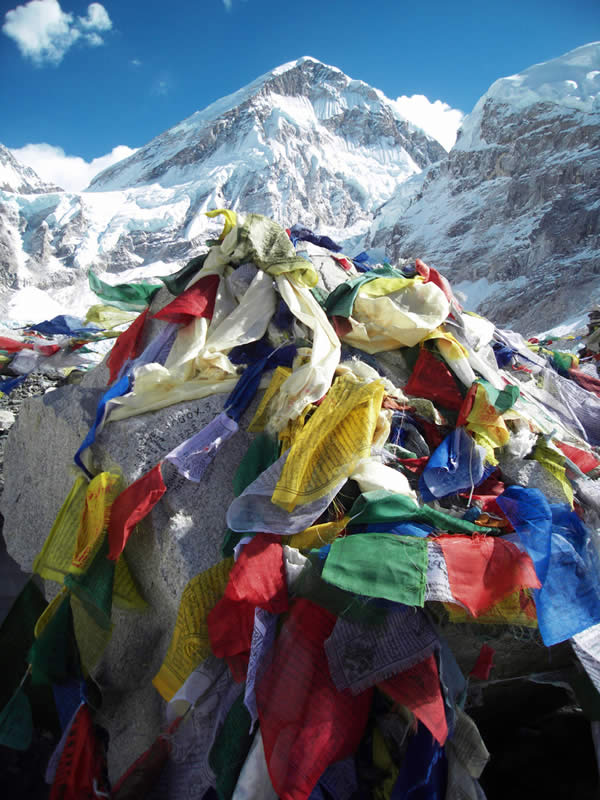 Flags and mountains reflect each other