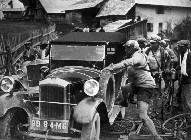 Felix Sellier is angry after being hit by a car. Tour de France, early 1920s.