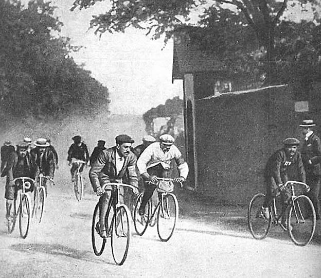 Cyclists ride in the first running of the Tour de France, in 1903. Maurice Garin, center with pale jersey, won the event.