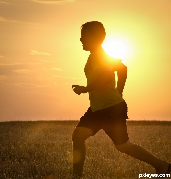 Child running at sunset