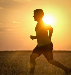 Child running at sunset