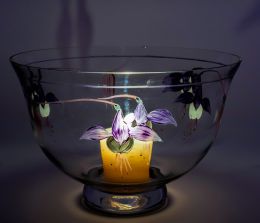 Glass bowl lit by candle