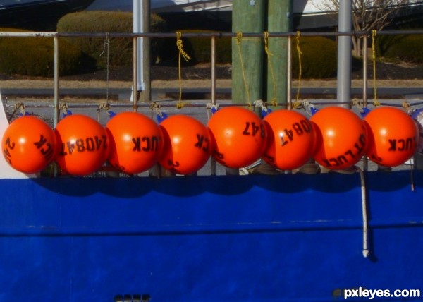 Orange Floats, Blue Boat