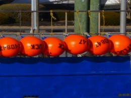 Orange Floats, Blue Boat