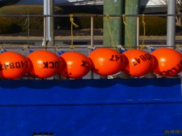 Orange Floats, Blue Boat