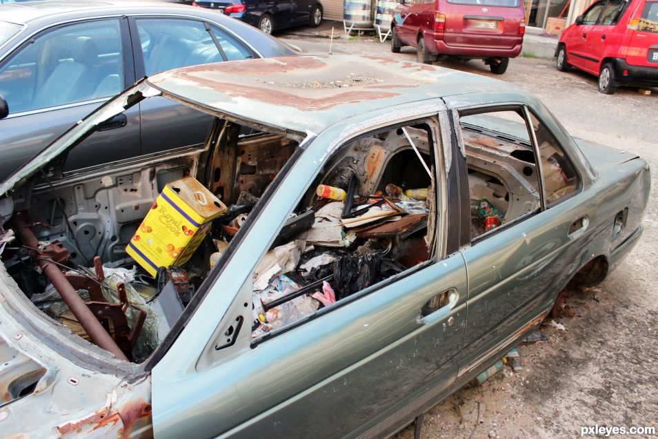 Decaying car and contents, Brunei  Entry number 109976