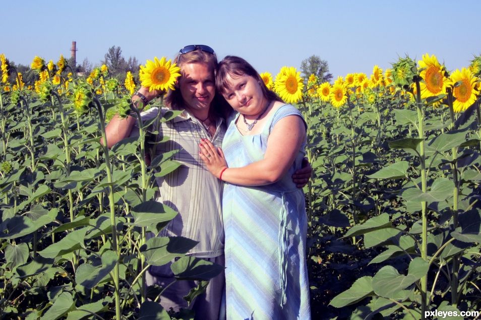 Happy among sunflowers