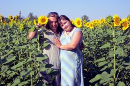 Happy among sunflowers