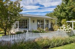 Id love a little cottage with a white picket fence.