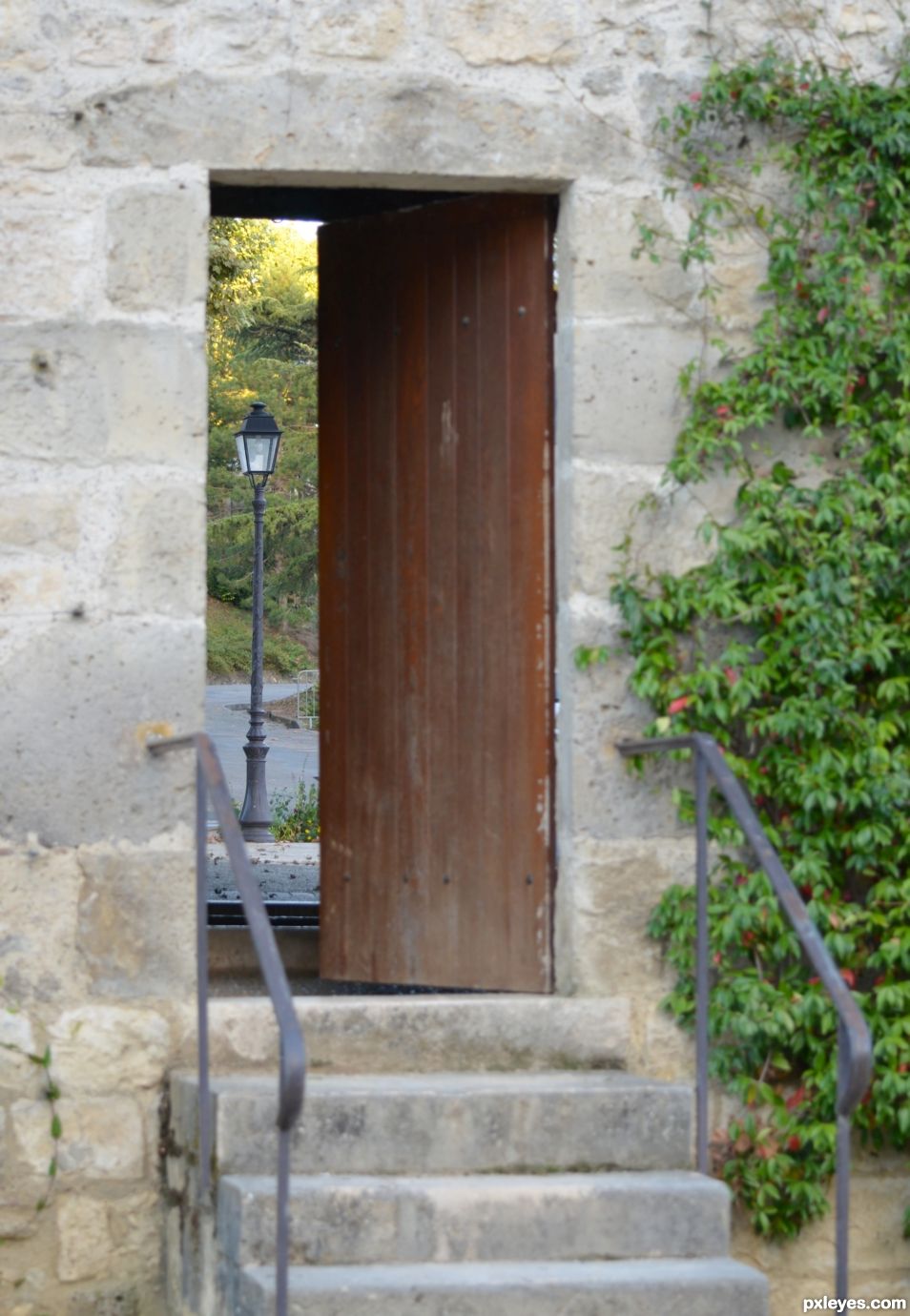 There is a street lamp behind the door