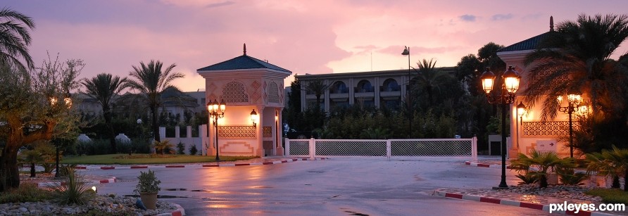 White gate at sunset