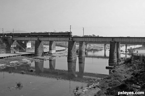 Train on old stone bridge