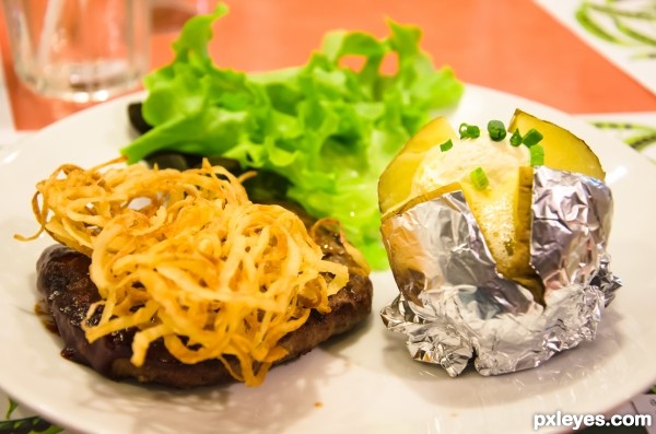 Beef steak and baked potato.