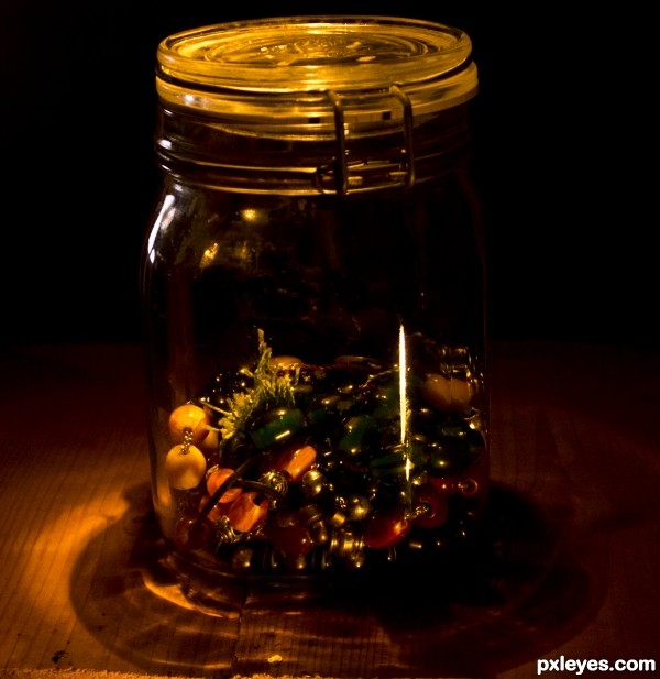 A jar half full of worry beads