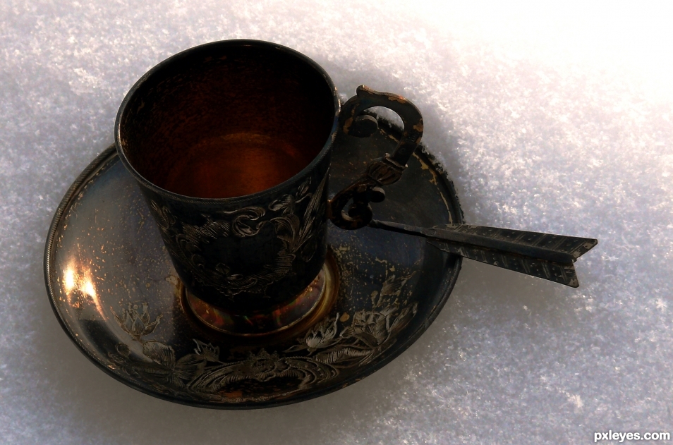 A coffee cup in the snow.