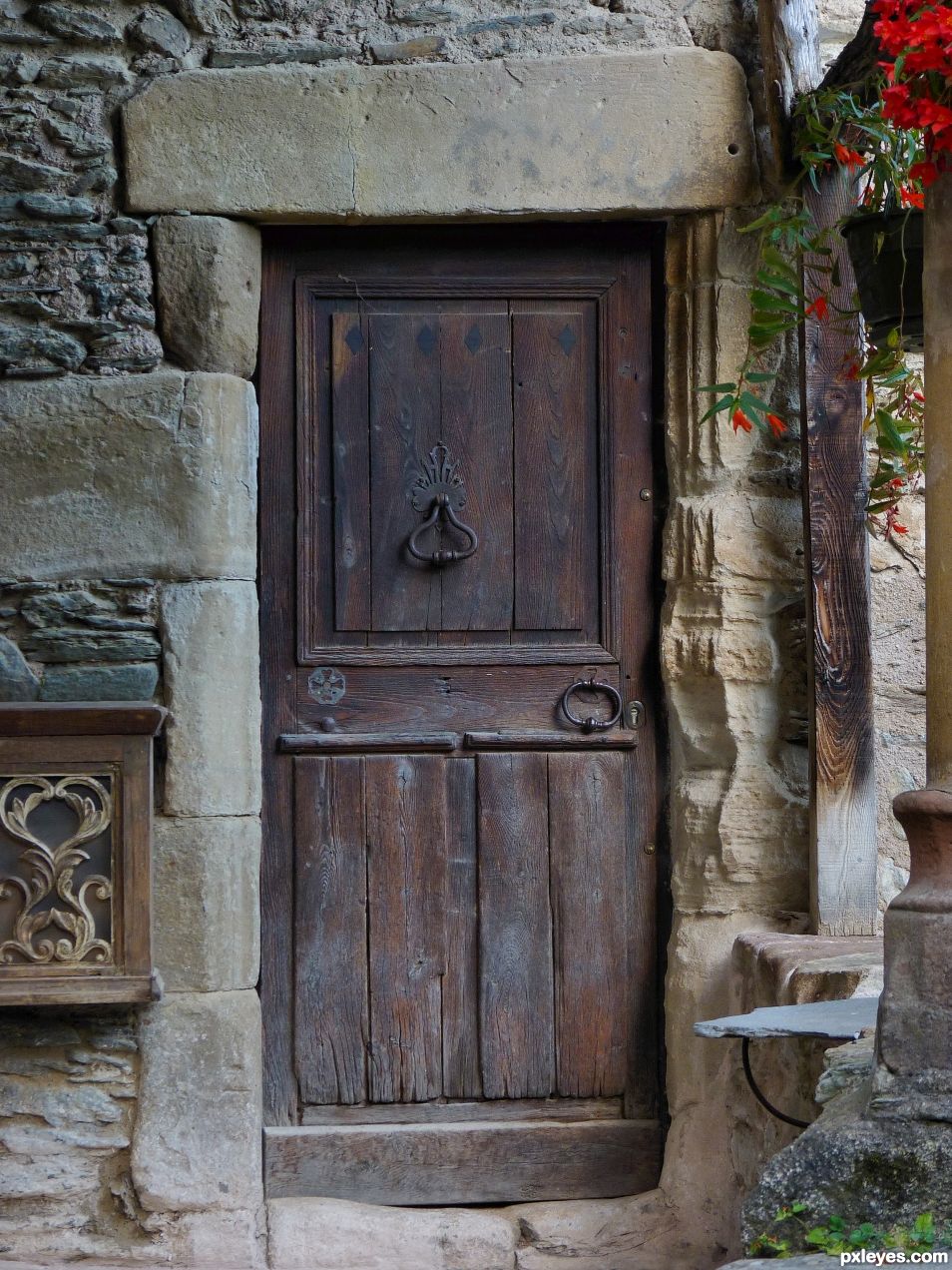 Old Stones, flowers and door