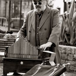 Barrel organ player Picture