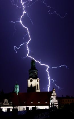 Church Illuminated by Lightning 