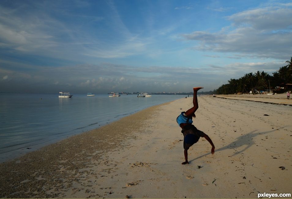 Acrobat on beach