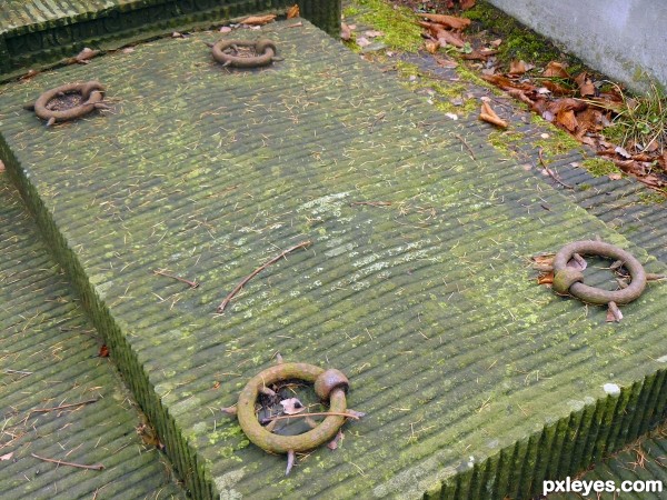 Tombstone with rusty handles