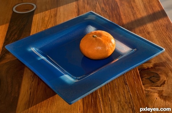 Blue plate with mandarine