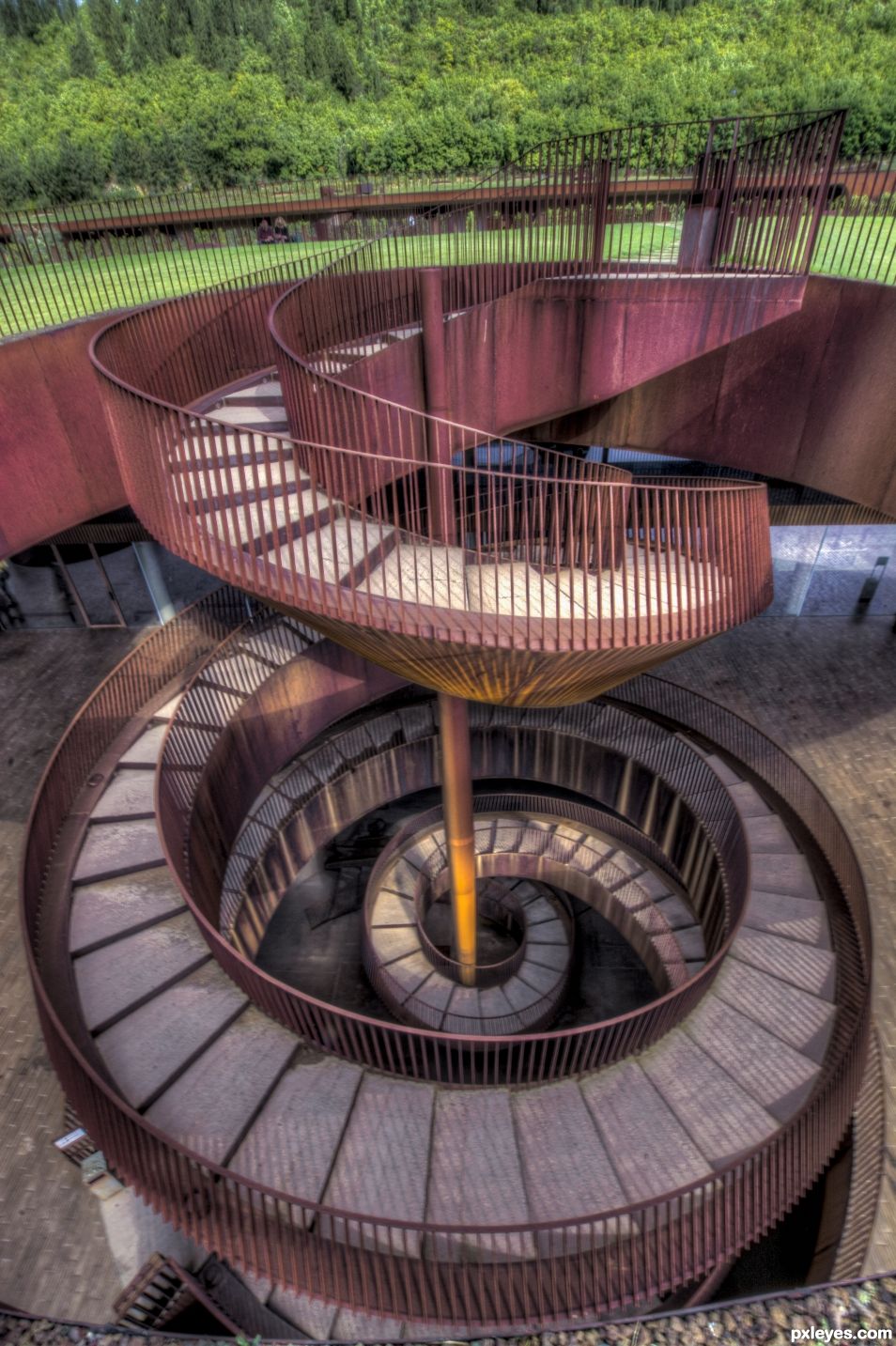 In a winery, a staircase in corkscrew ...