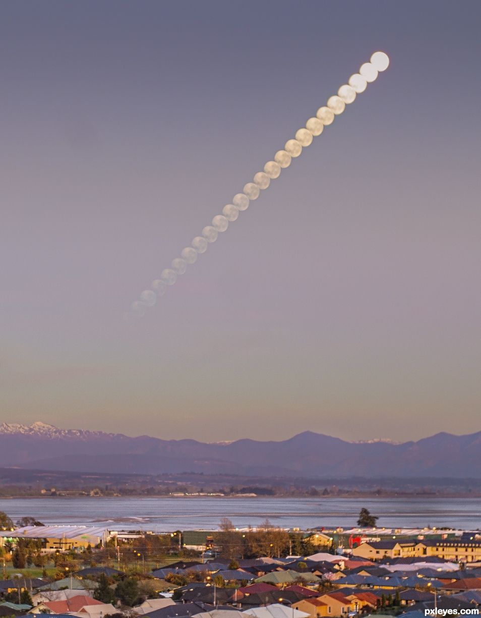 Moon setting during sunrise