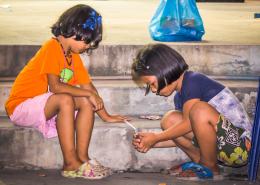 Two kids playing at the middle of the night