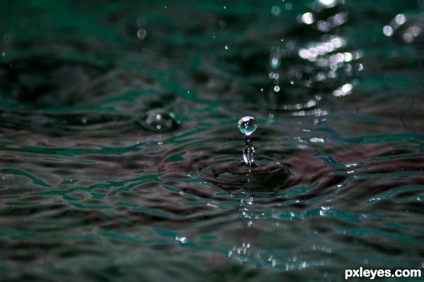 Rain hitting pool water