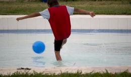 Kid playin Soccer on Water