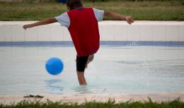 Kid playin Soccer on Water